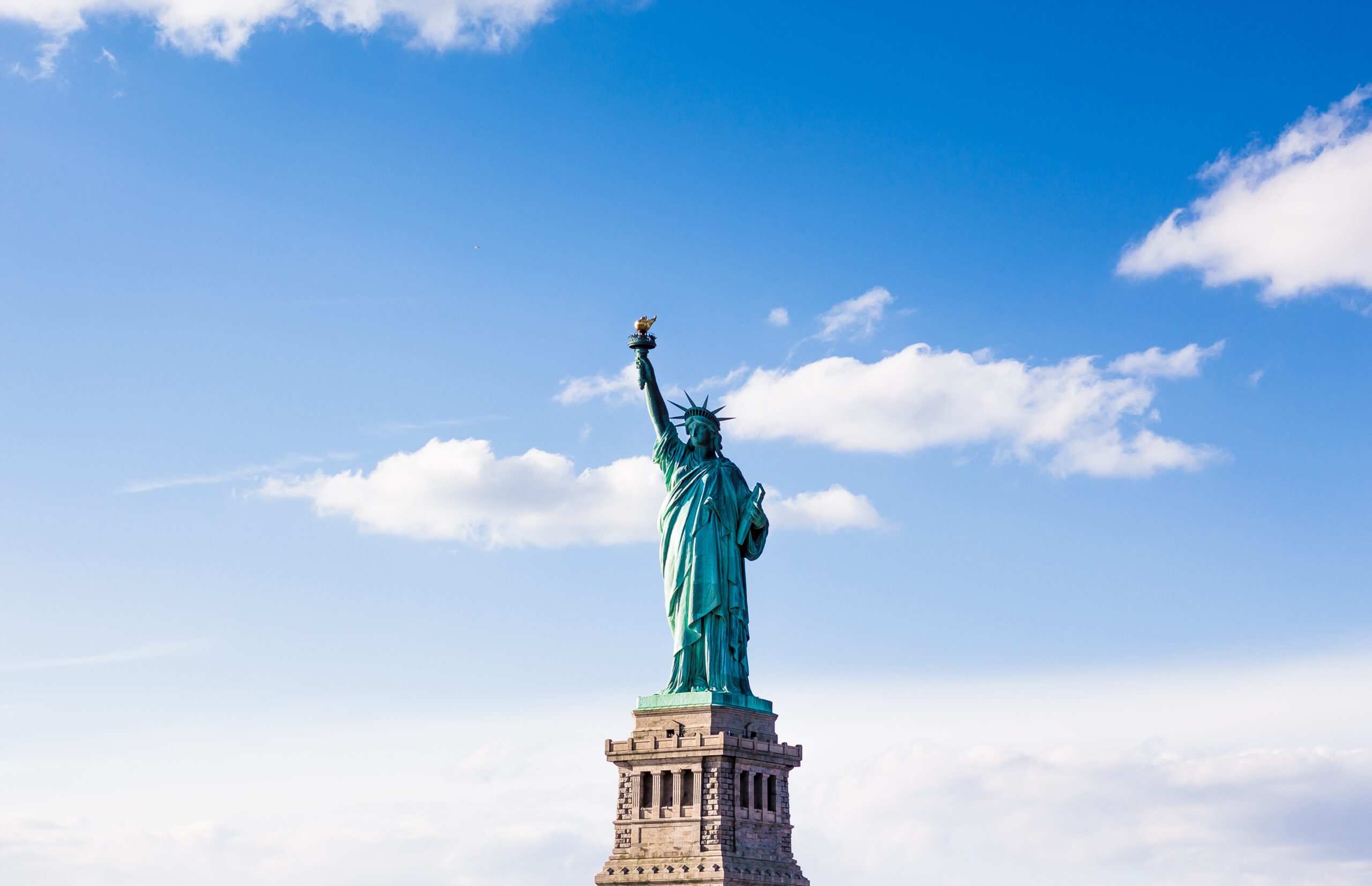 The Statue of Liberty with a cloudy beautiful sky in the background